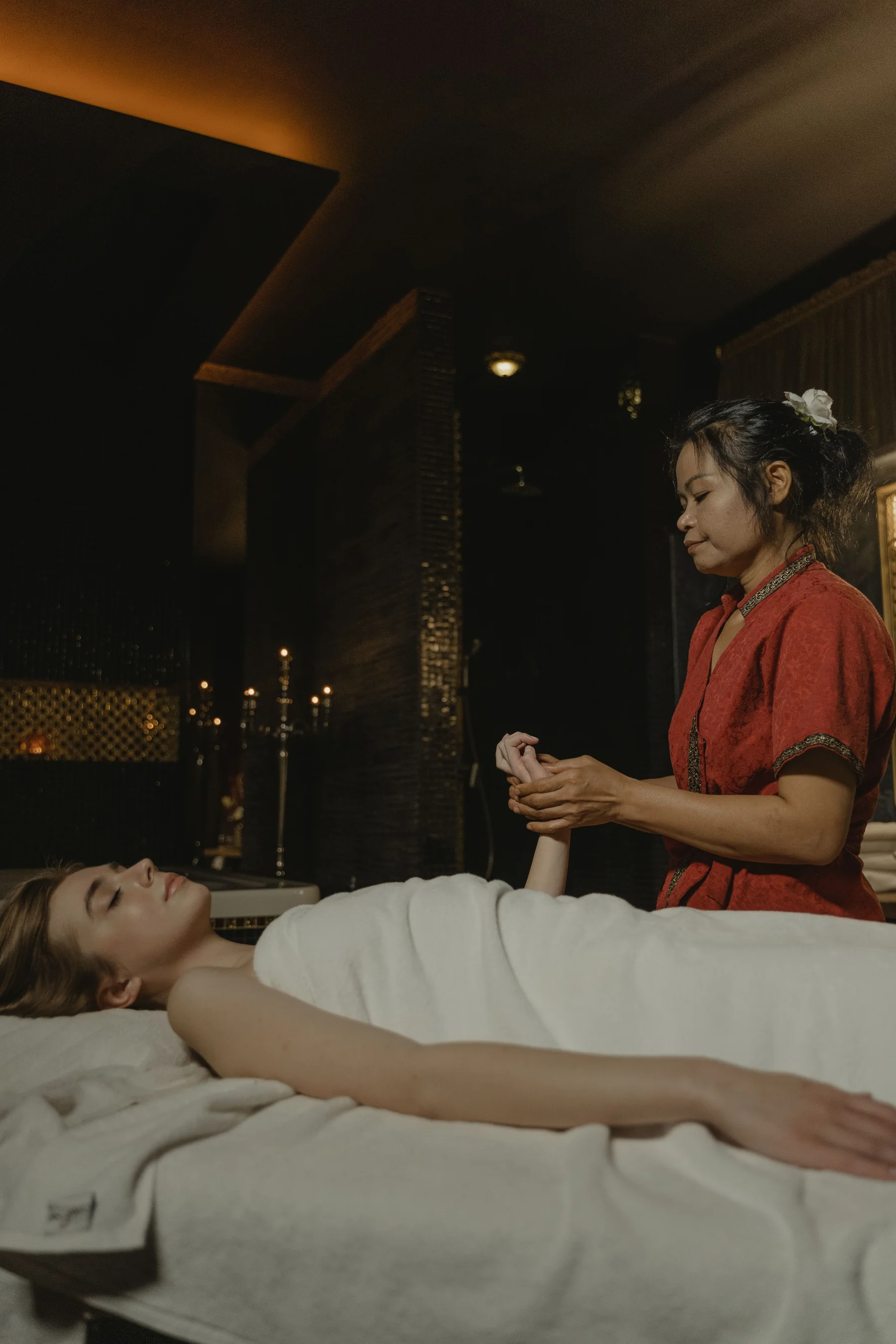 Professional massage specialist in a calm spa environment